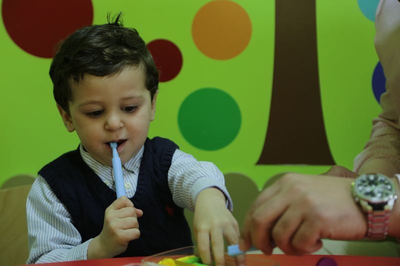 Smiling boy during a therapy session