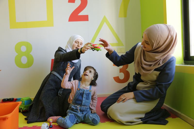 Therapist working with a young girl