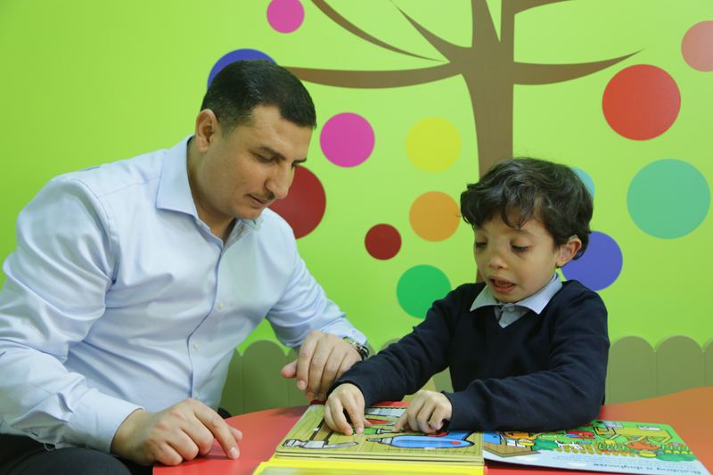 Therapist reading with a child